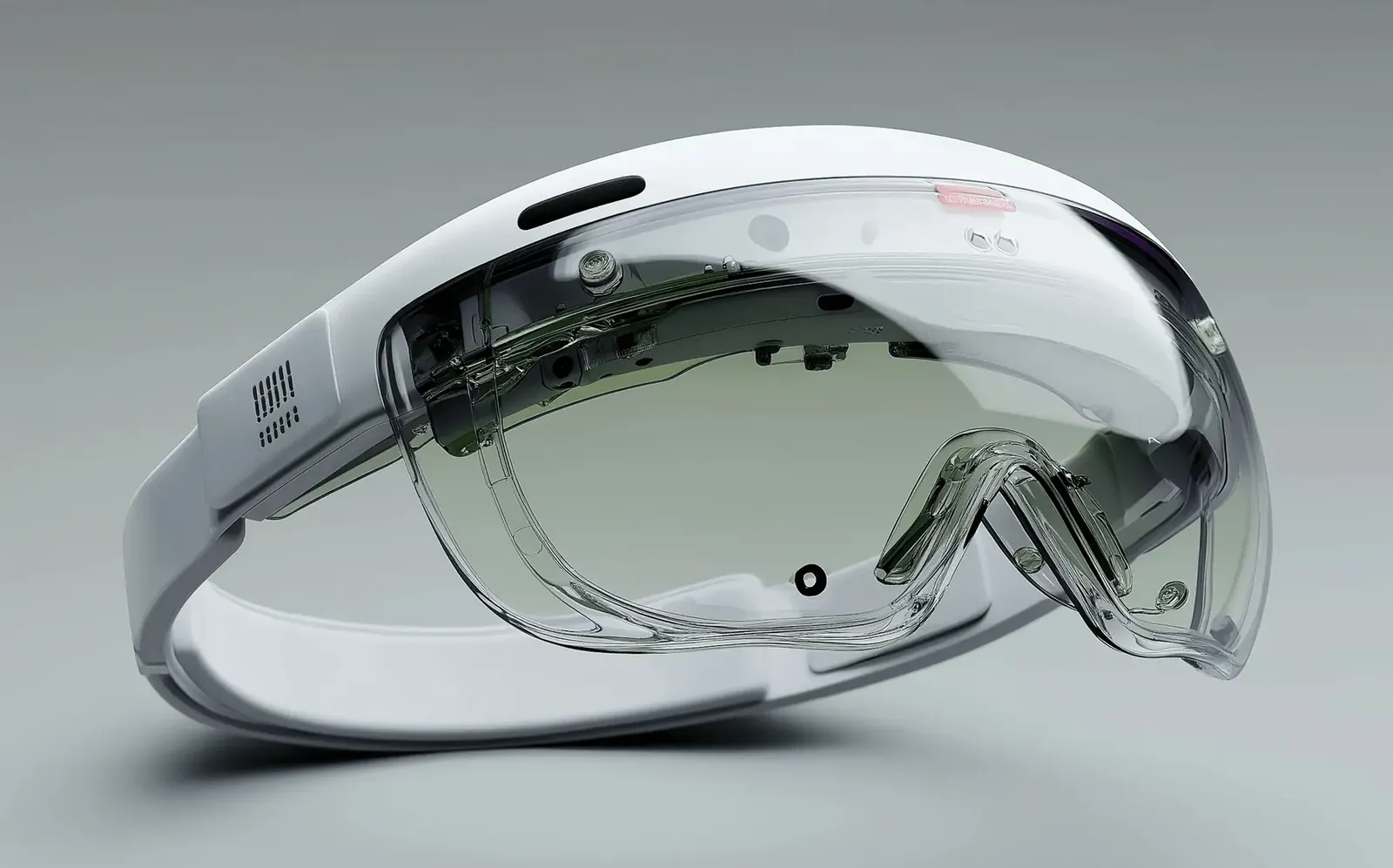 White mixed-reality headset on a grey background